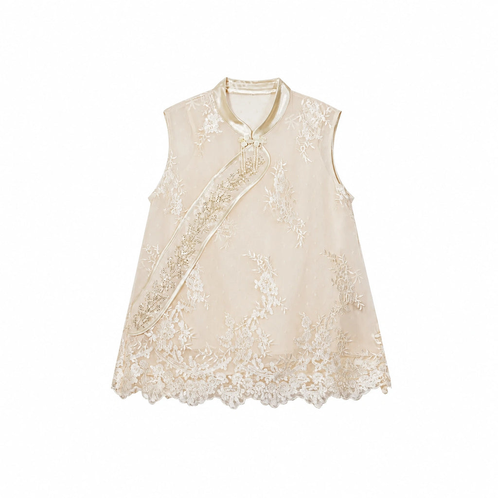 Flat lay of a champagne gold sleeveless vest with bead embroidery, scalloped lace hem, and traditional side button closures.