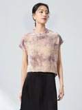 Front view of a women's New Chinese Style top in champagne, with a stand collar, delicate frog buttons, and an intricate jacquard/flocking pattern.