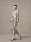 Elegant champagne mulberry silk blend blouse styled with a satin skirt
