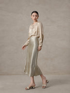 Elegant champagne mulberry silk blend blouse styled with a satin skirt