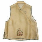 Back product view of the champagne yellow layered silk vest with green piping and floral embroidery