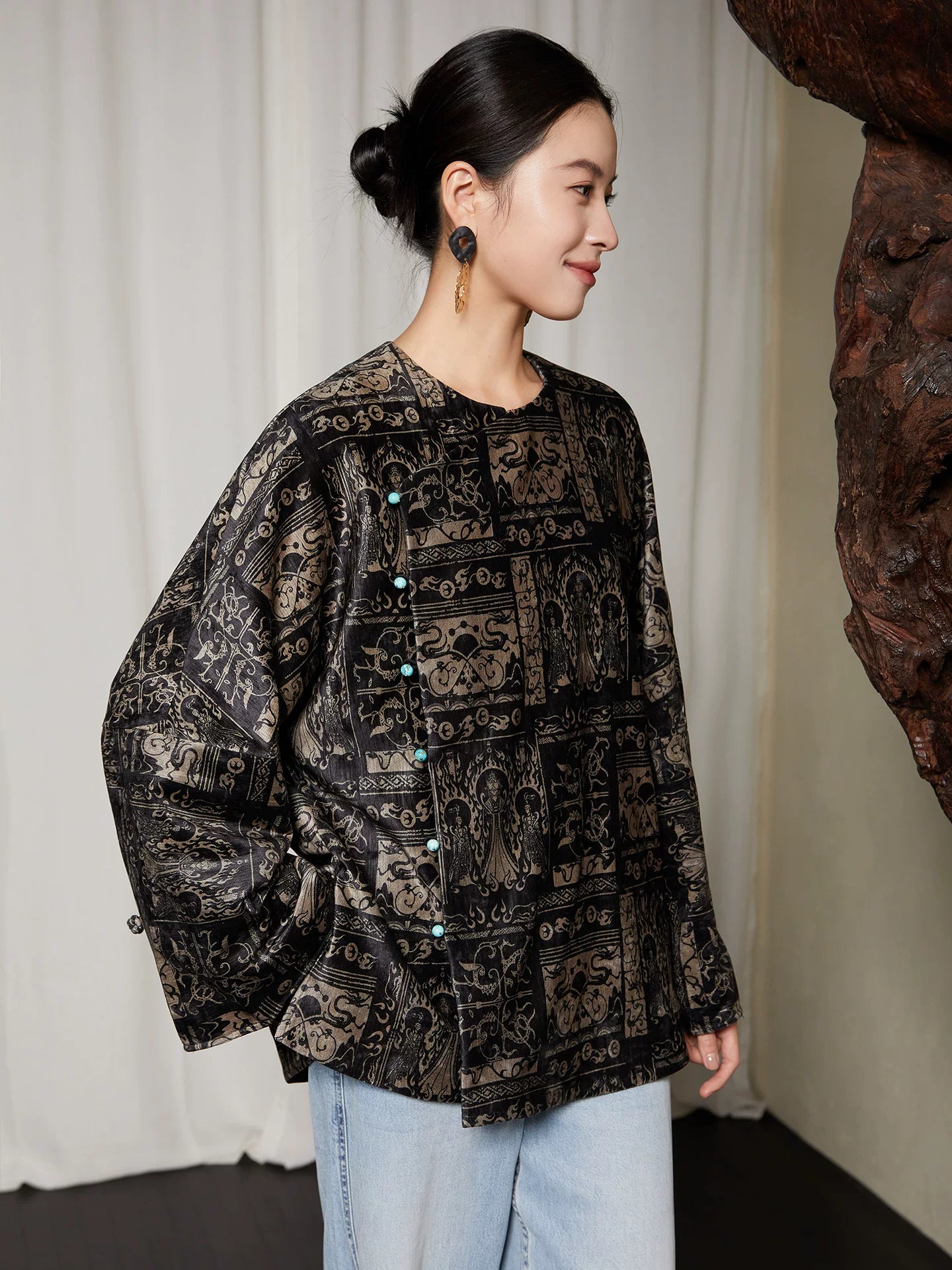 Side view of charcoal black Chinese inspired blouse