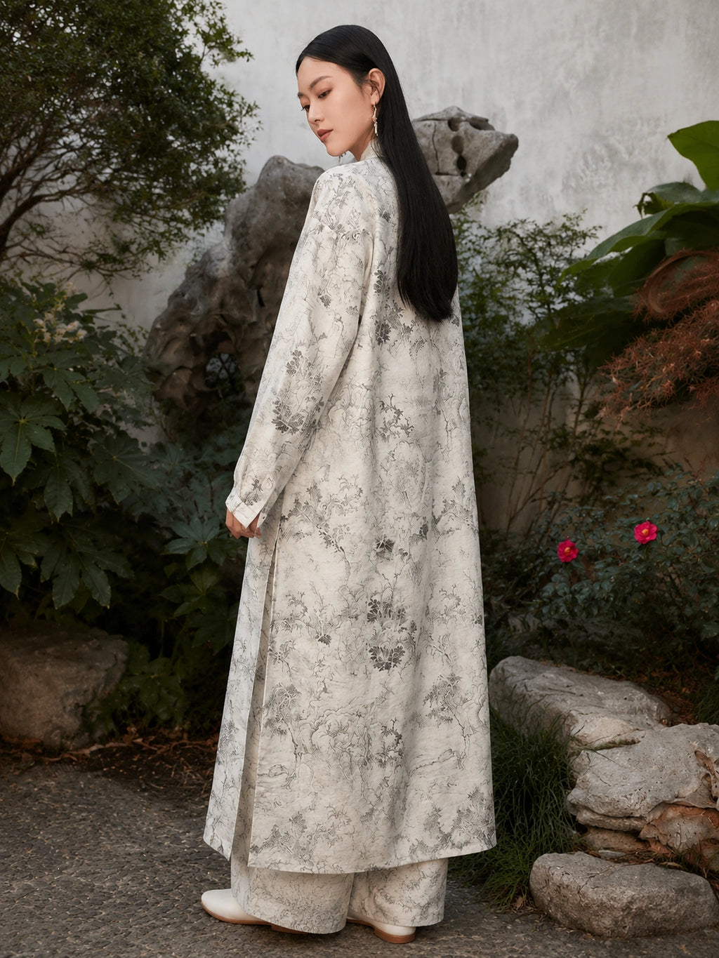 Back view of an ivory Chinese ink landscape print maxi dress featuring a relaxed fit, flowing silhouette and elegant long sleeves.