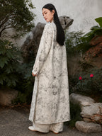 Back view of an ivory Chinese ink landscape print maxi dress featuring a relaxed fit, flowing silhouette and elegant long sleeves.