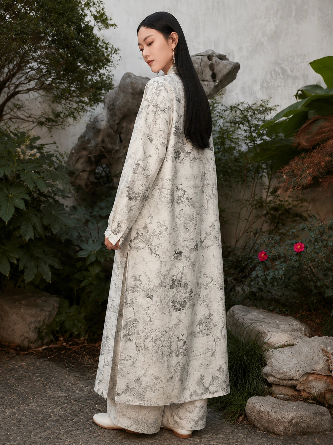 Back view of an ivory Chinese ink landscape print maxi dress featuring a relaxed fit, flowing silhouette and elegant long sleeves.