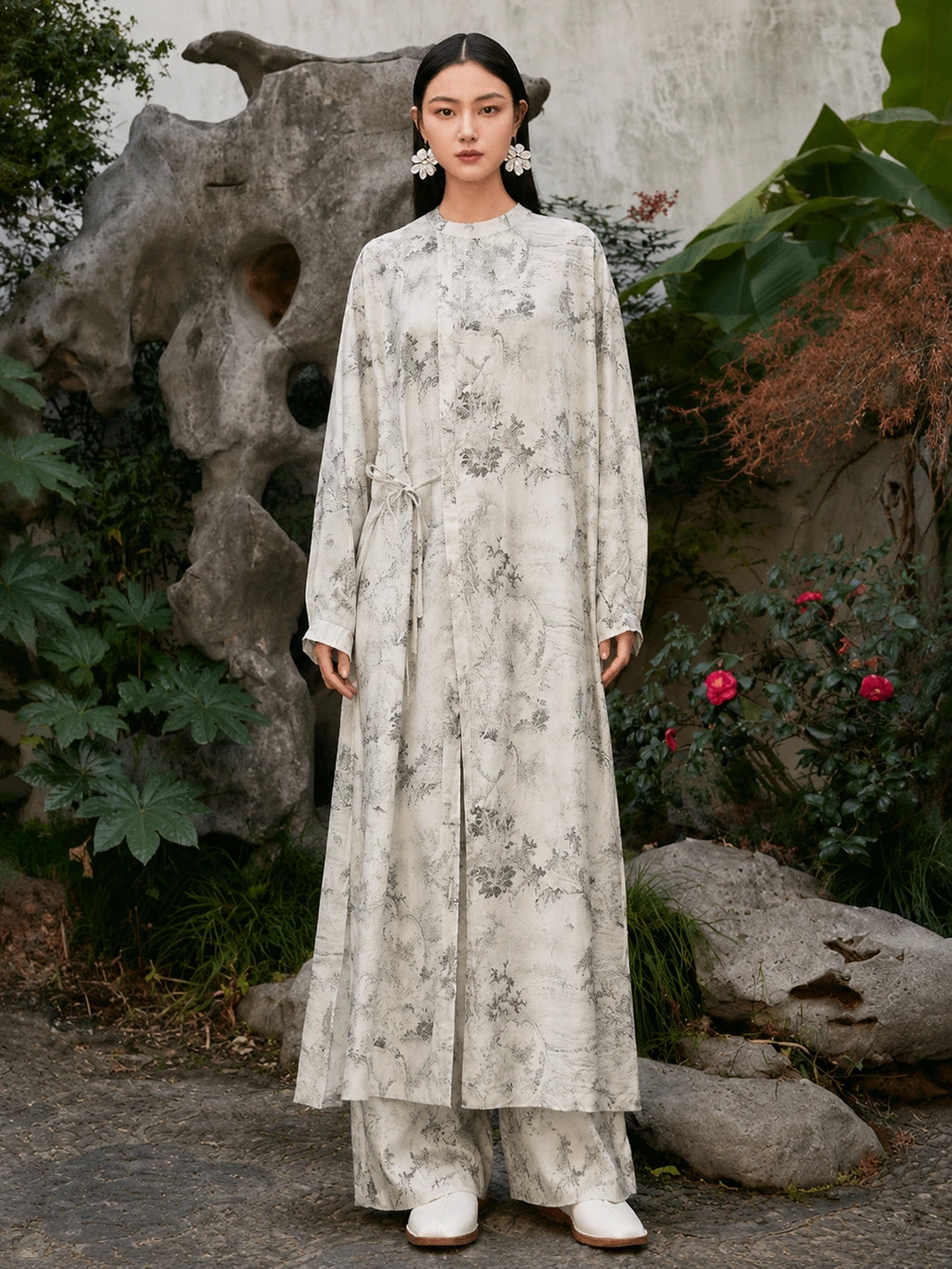 Full front view of an ivory Chinese ink landscape print maxi dress with elegant drape, long sleeves and artistic oriental-inspired print.