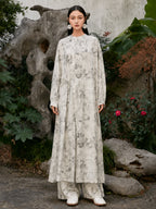Full front view of an ivory Chinese ink landscape print maxi dress with elegant drape, long sleeves and artistic oriental-inspired print.