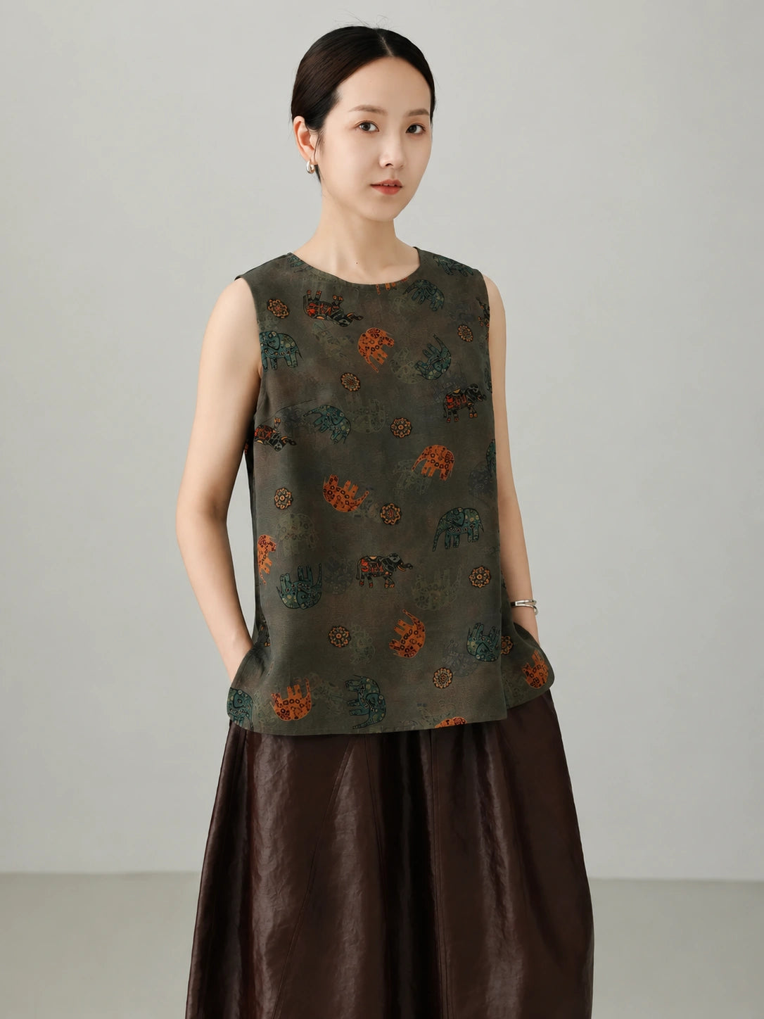 Women's Chinese-inspired Xiangyunsha silk tank top with minimalist cut, elephant motif pattern and elegant oriental aesthetic