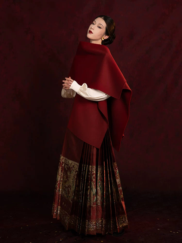 Chinese-style embroidered blouse and Mamian skirt styled with a shawl for formal occasions.