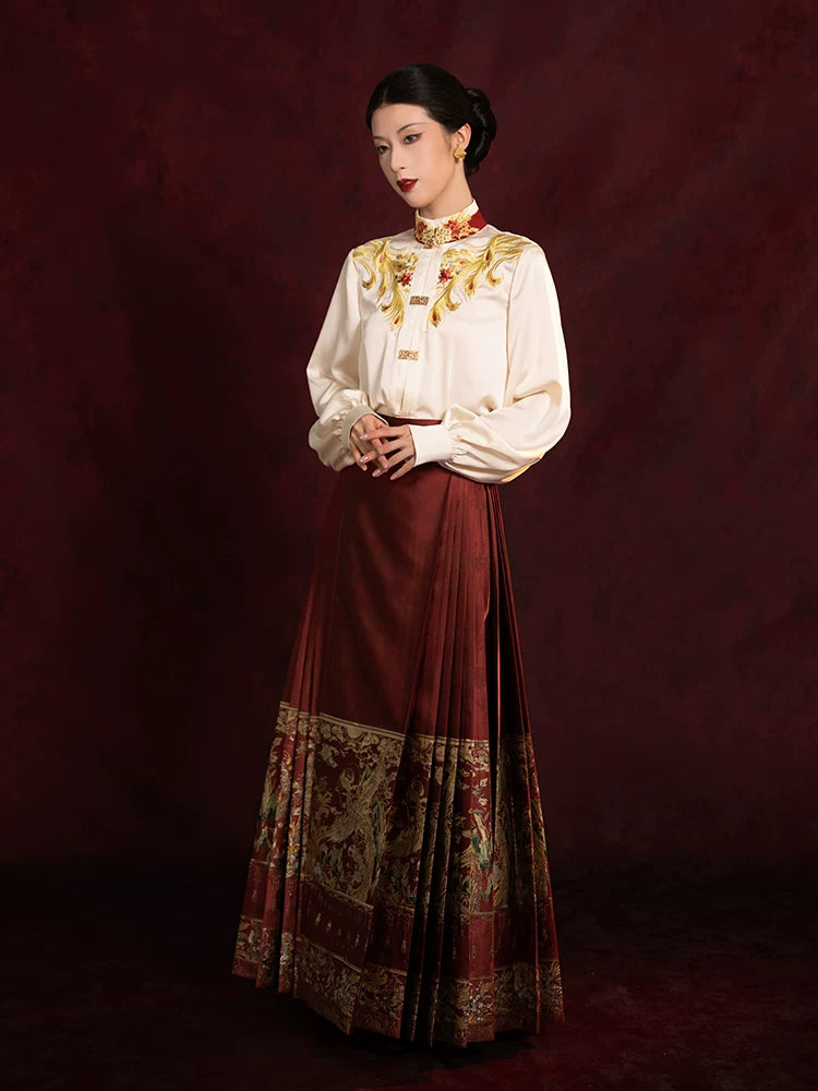 Elegant embroidered blouse paired with a pleated Mamian skirt for a refined Chinese-inspired look.