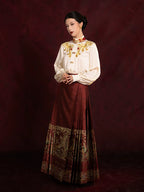 Elegant embroidered blouse paired with a pleated Mamian skirt for a refined Chinese-inspired look.