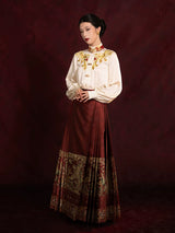 Elegant embroidered blouse paired with a pleated Mamian skirt for a refined Chinese-inspired look.