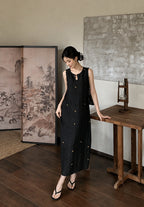 Woman wearing a traditional-inspired Xiangyunsha silk dress with star embroidery and flowing silhouette