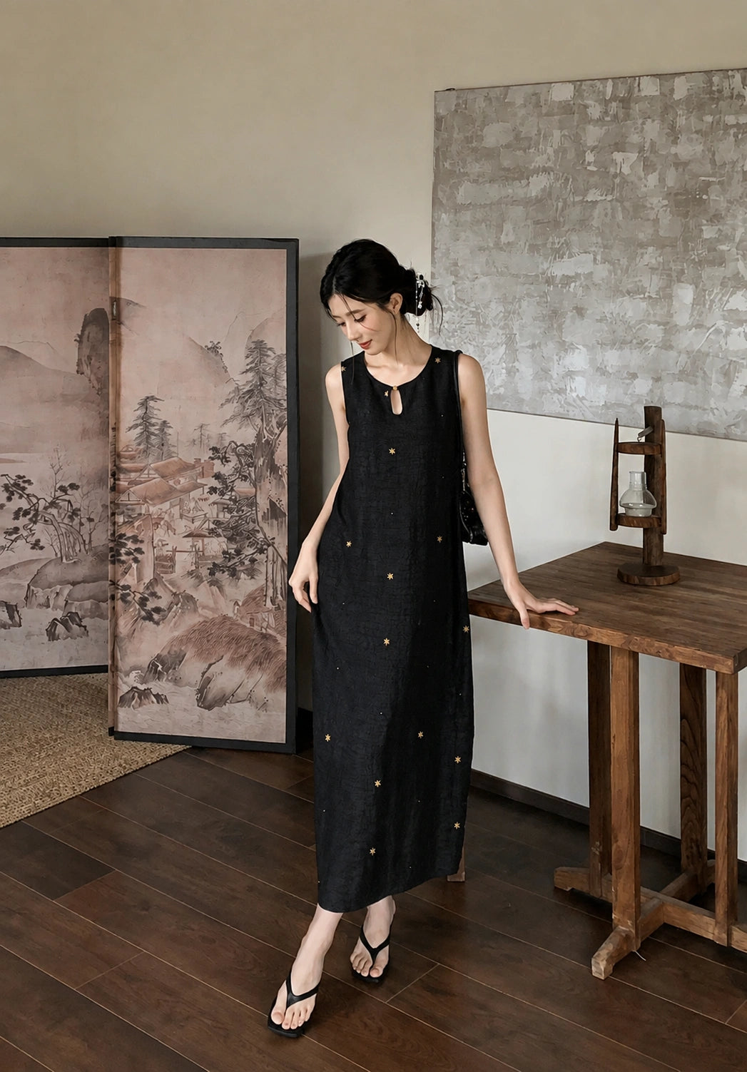 Woman wearing a traditional-inspired Xiangyunsha silk dress with star embroidery and flowing silhouette