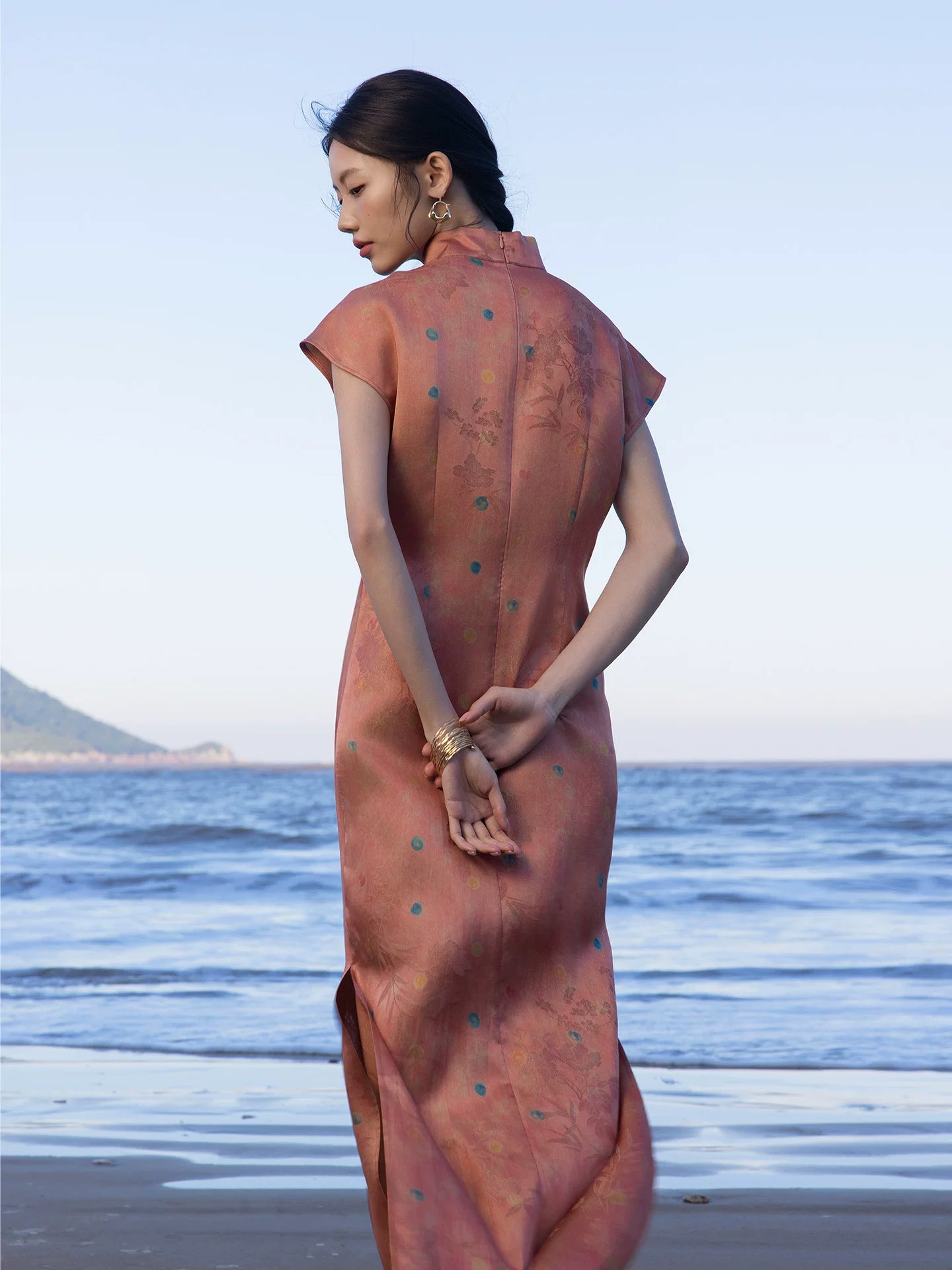 Back view of a Chinese style silk blend maxi dress in Coral Sunset.