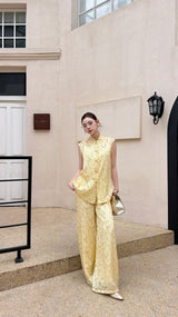 Front view of a mandarin collar Cheongsam set in cream yellow, with tonal jacquard texture and an elegant silhouette.