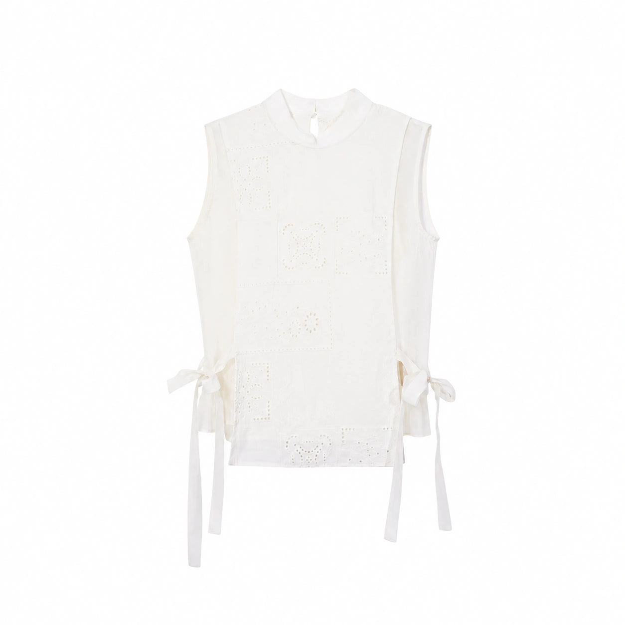Flat lay of a cream white sleeveless Cheongsam vest with geometric embroidery, side ties, and a front button closure.