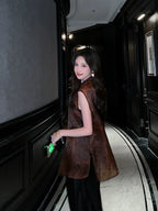 Back side view of a woman wearing a Dark Walnut Brown Mulberry Silk jacquard sleeveless vest.