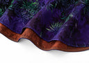 Close-up of the purple blouse’s curved hem, stitching and contrasting rust-coloured reverse.