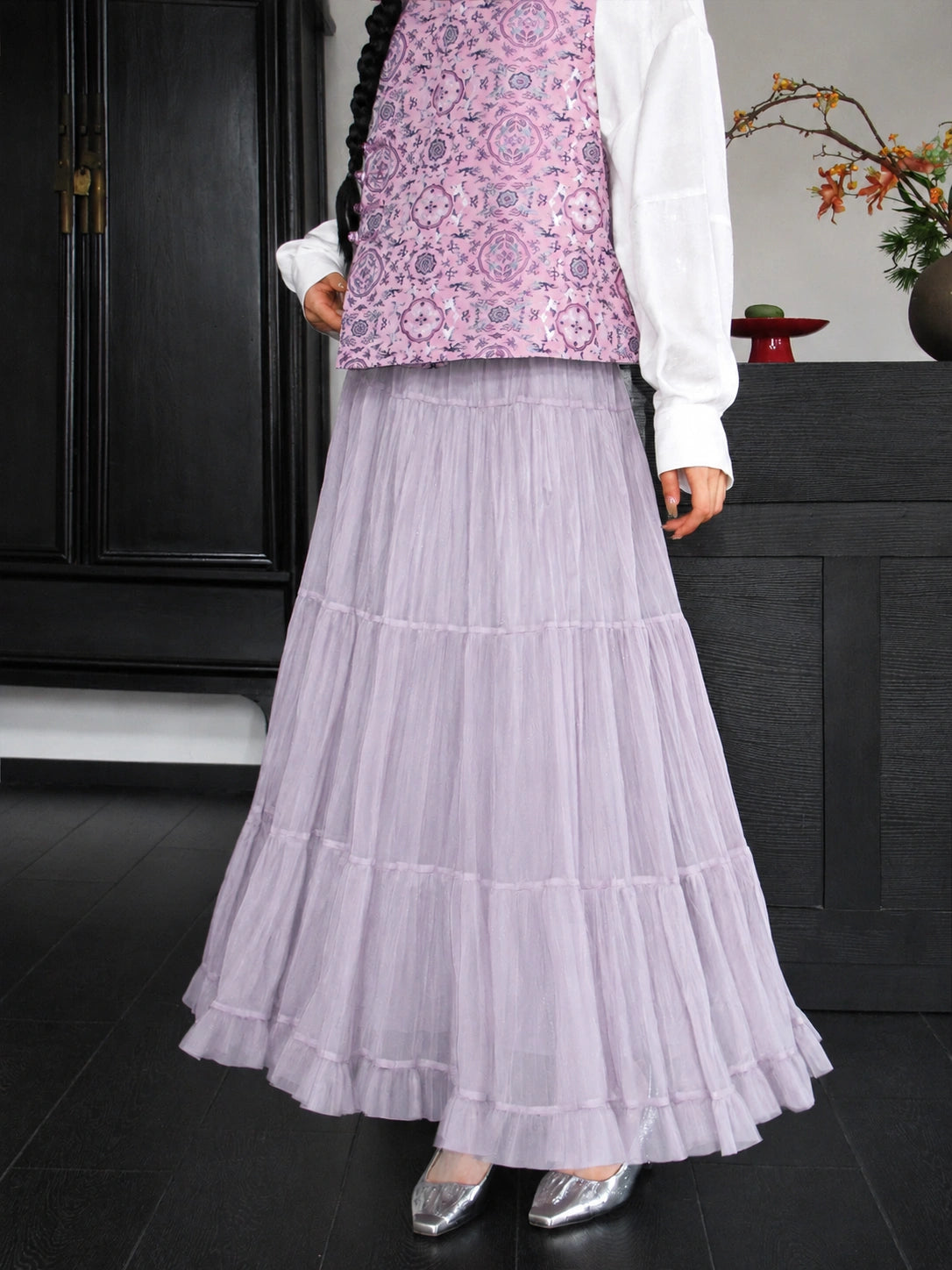Close-up of the dusty lavender silk vest with an intricate repeating Bao Xiang floral pattern.