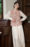 Front styling view showing the vest’s round neckline, buttons and decorative chest band.
