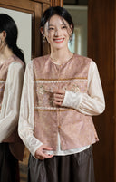 Portrait highlighting the rose jacquard vest and its floral-and-vase chest motif.