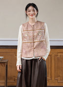 Model wearing the rose jacquard vest over a cream blouse, shown from the front.