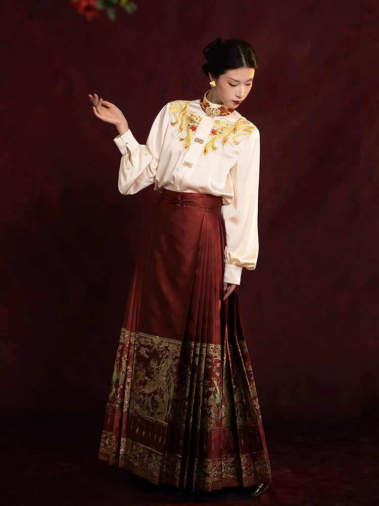 Side view of an embroidered Chinese-style blouse with a flowing pleated Mamian skirt.
