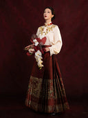 Women's embroidered Chinese-style blouse and pleated Mamian skirt set with elegant traditional-inspired design.