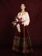 Women's embroidered Chinese-style blouse and pleated Mamian skirt set with elegant traditional-inspired design.