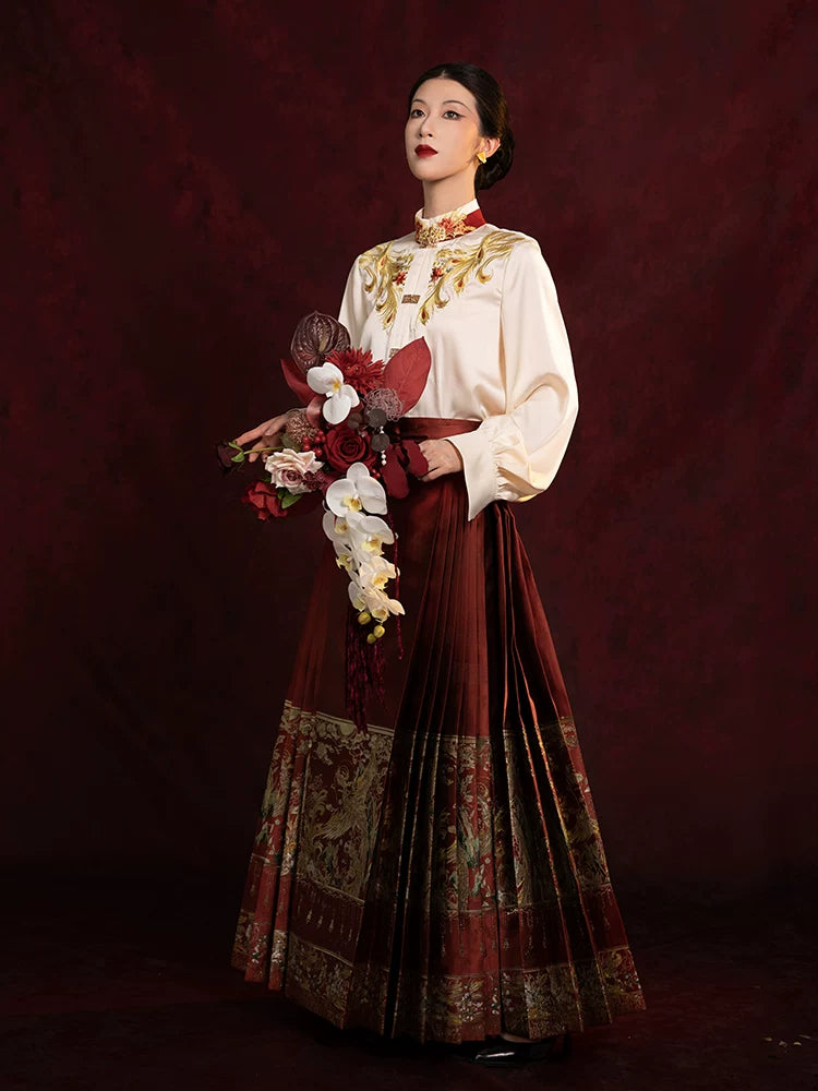 Women's embroidered Chinese-style blouse and pleated Mamian skirt set with elegant traditional-inspired design.