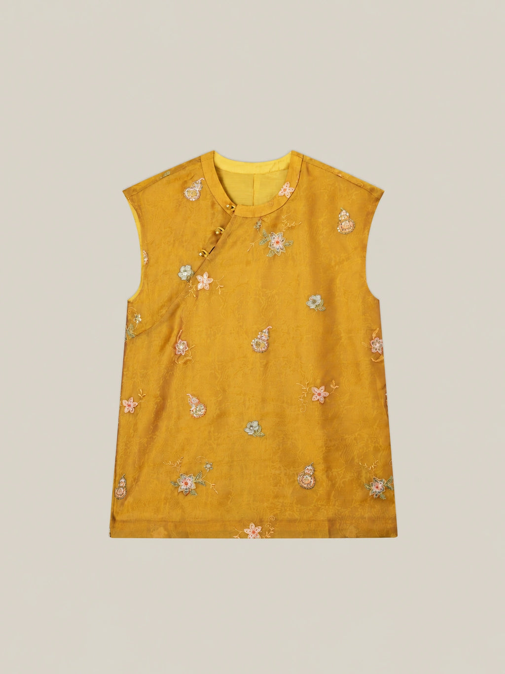 Women's golden mulberry silk vest with floral embroidery and modern Chinese inspired sleeveless design