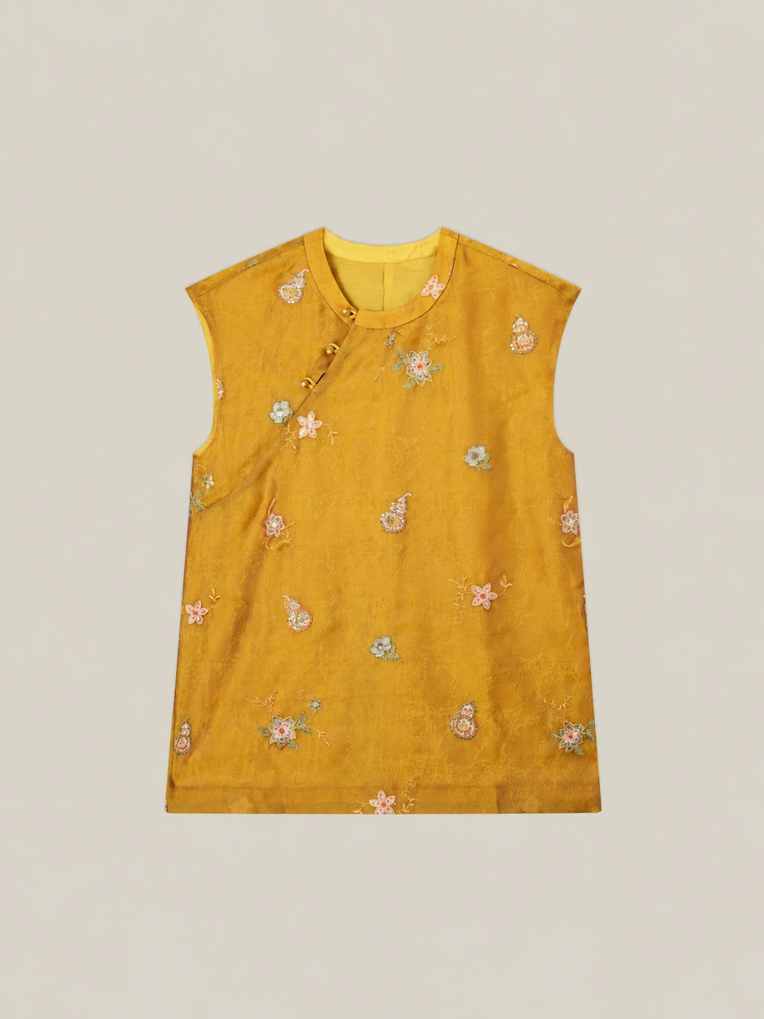 Women's golden mulberry silk vest with floral embroidery and modern Chinese inspired sleeveless design