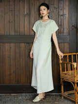 Women's embroidered relaxed maxi dress in light sage green with short sleeves and natural textured fabric by Gambiered Silk