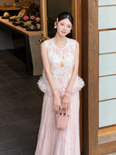 Full body shot of a white Cheongsam vest with a ruffled hem, styled with a pink pleated skirt and a pink handbag, featuring delicate embroidery.