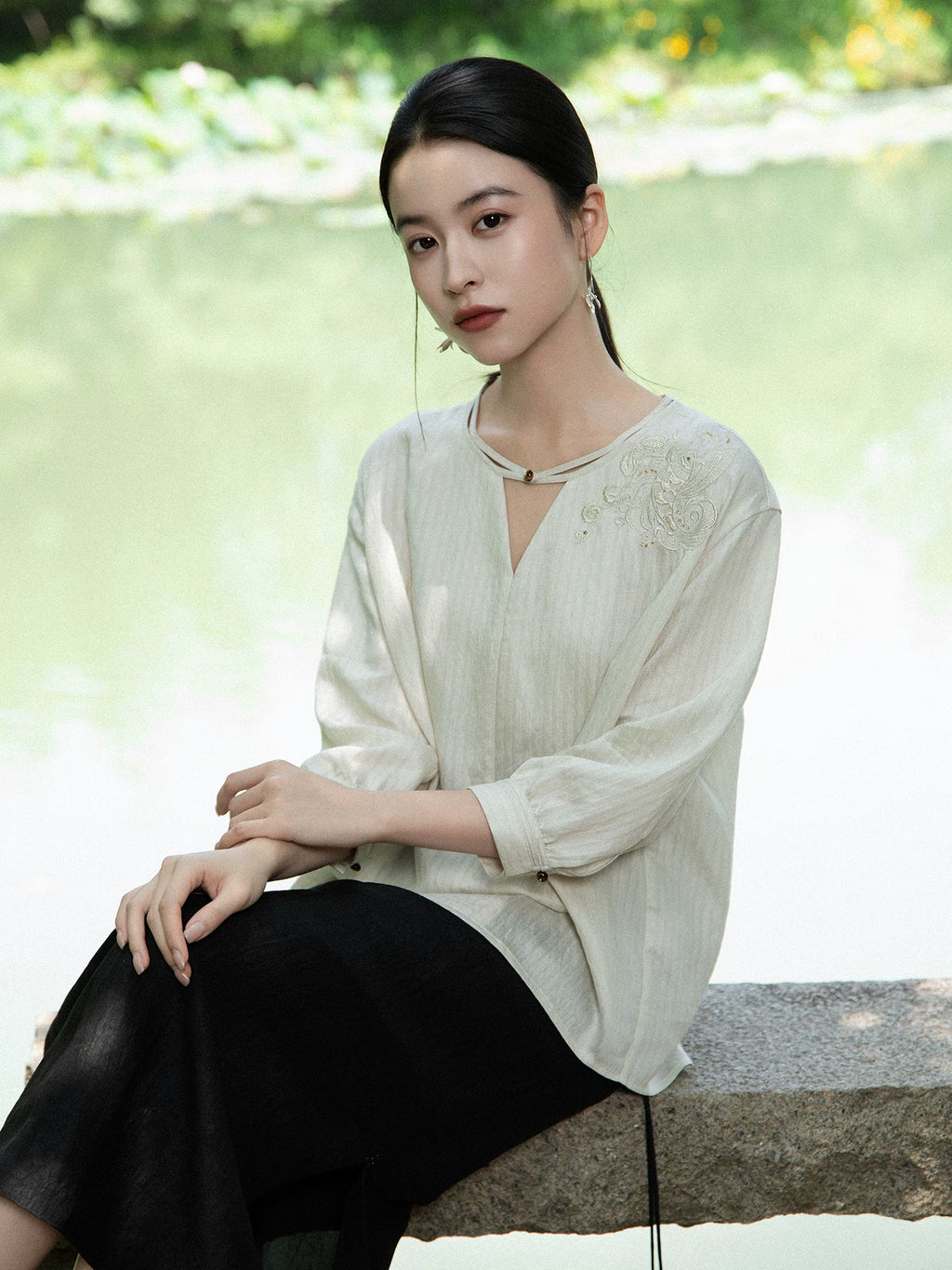 Women's embroidered viscose blend V-neck blouse in a relaxed fit.
