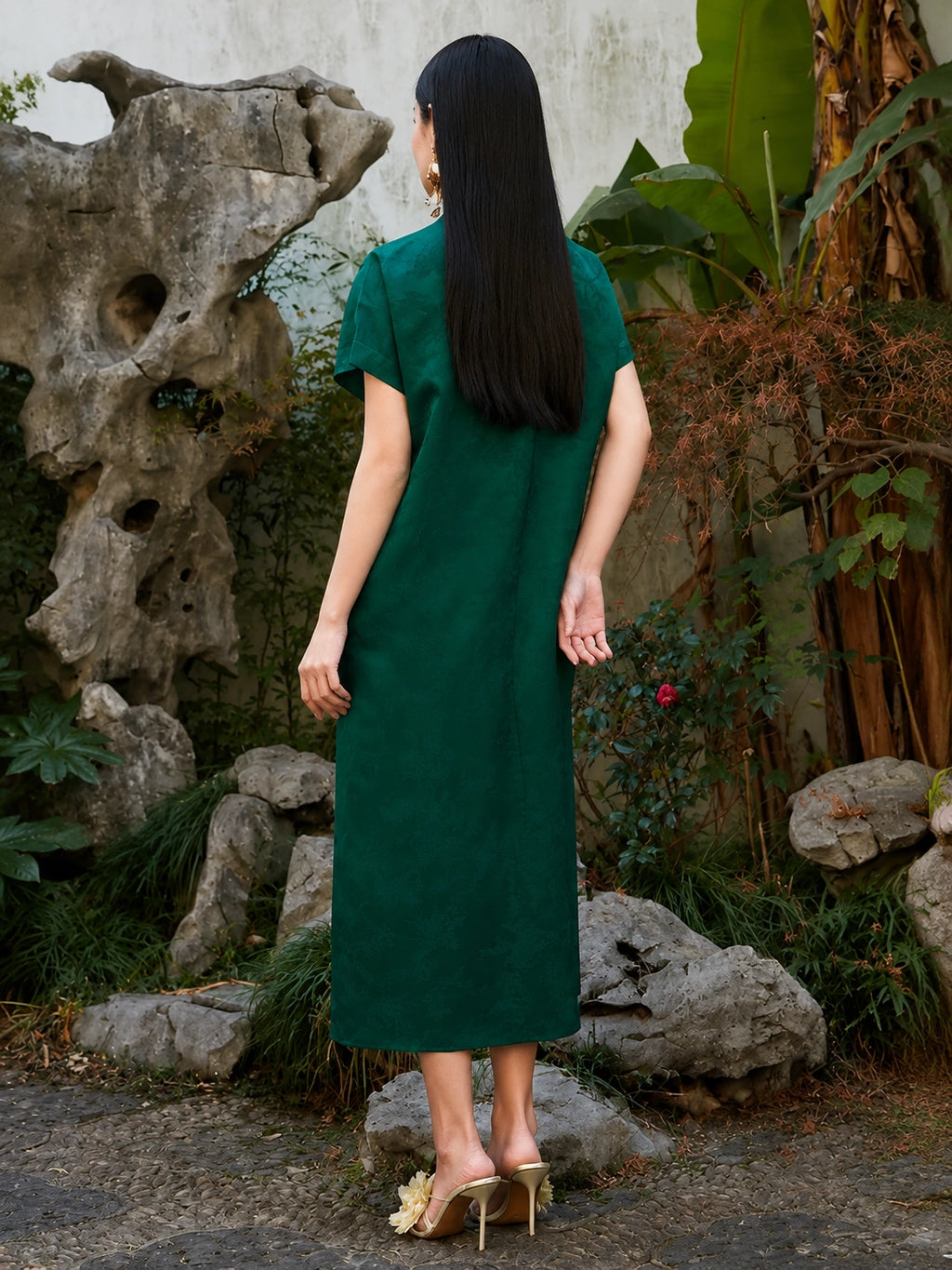 Back view of emerald green floral jacquard viscose midi dress.