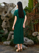 Back view of emerald green floral jacquard viscose midi dress.