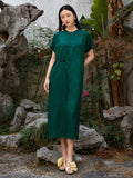 Front view of emerald green floral jacquard midi dress in 100% viscose.