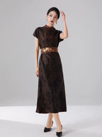Woman wearing an espresso brown 100% mulberry silk jacquard maxi dress with a relaxed Oriental-inspired silhouette.
