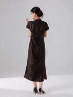 Back view of a 100% mulberry silk maxi dress showcasing its clean lines and elegant drape.
