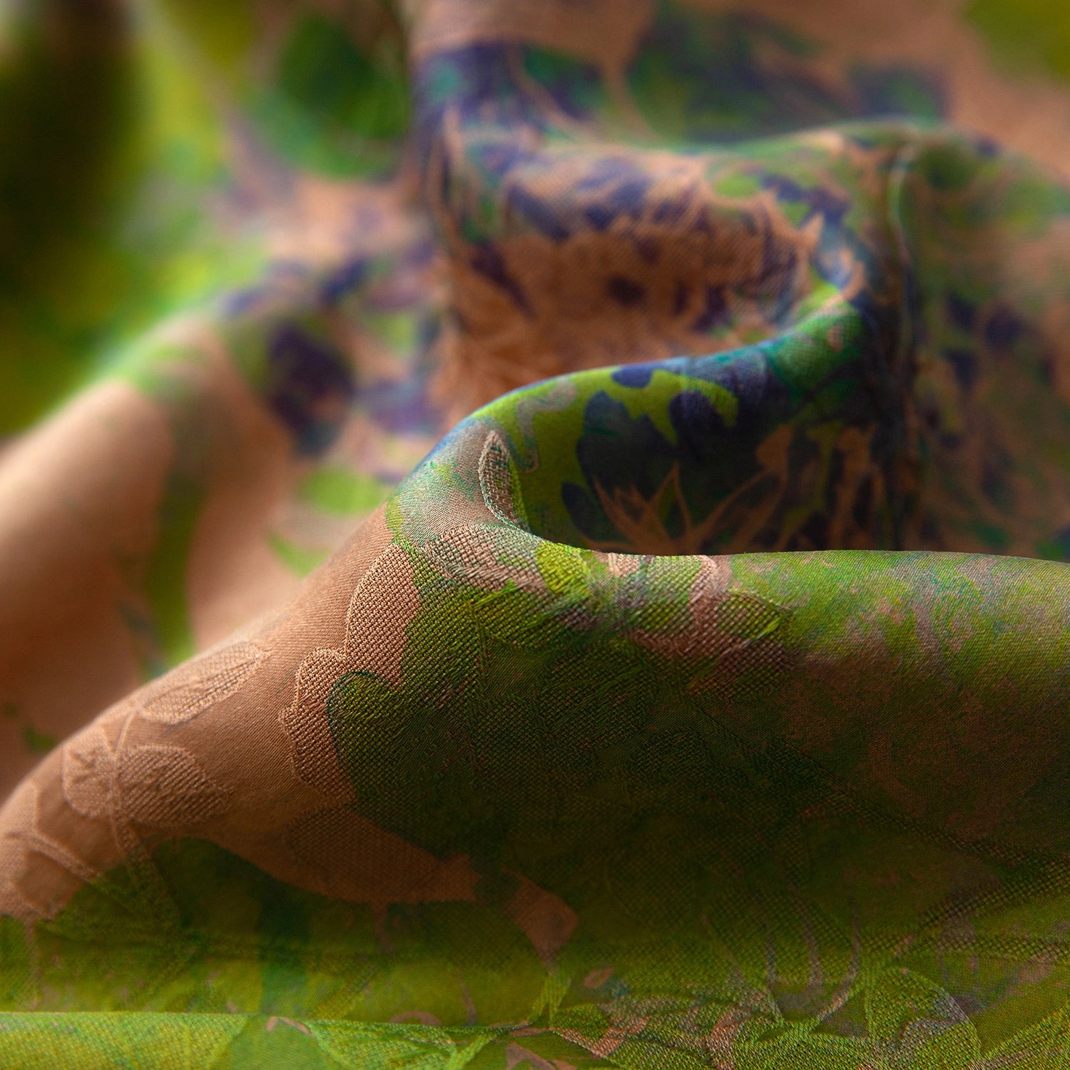 Close-up of the green and bronze floral texture of 100% mulberry silk Xiangyunsha fabric