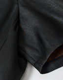 Close-up of the smooth black 40-momme mulberry silk satin fabric and short-sleeve construction