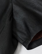 Close-up of the smooth black 40-momme mulberry silk satin fabric and short-sleeve construction
