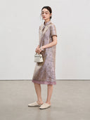 Side view of the light lavender A-line qipao with short sleeves and contrasting sheer hem