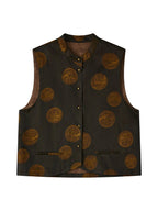 Front product view of a dark silk-blend Chinese vest featuring antique-gold botanical medallions and two welt pockets.