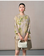 Front portrait of a model wearing the New Chinese mulberry silk blouse with botanical leaf print