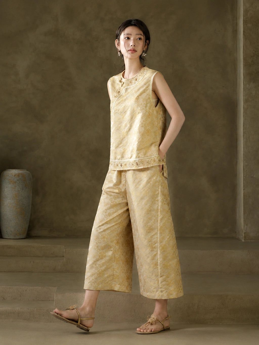 Model styling the sleeveless Baoxiang jacquard vest with coordinating wide-leg trousers