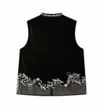 Back view of a jet-black mulberry silk velvet vest with ivory floral embroidery and a sheer paneled hem.