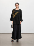 Front view of the black New Chinese silk jacket with gold sequin embroidery and button closure.